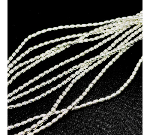 Нить гематит белый овал 4*6мм